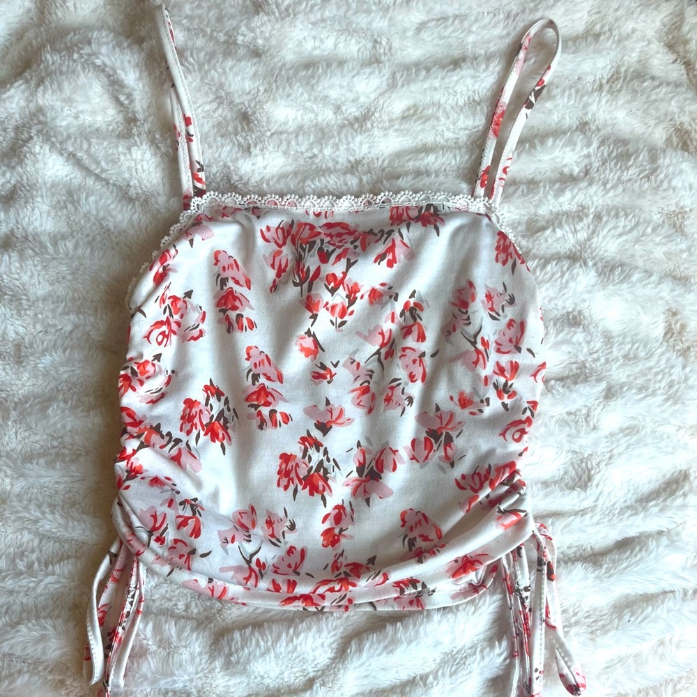 Floral spaghetti strap top with side bows.